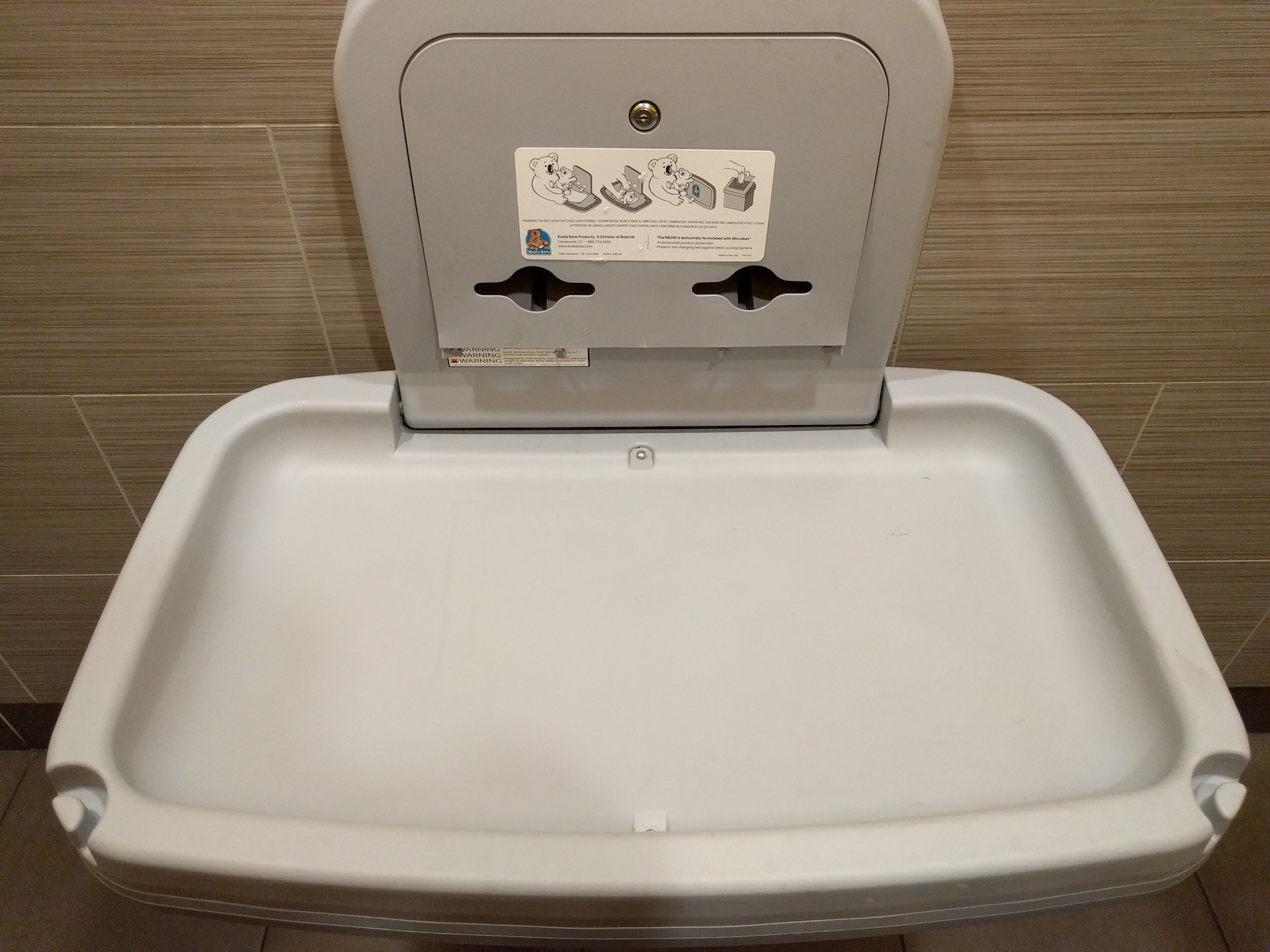 a changing table in a public restroom
